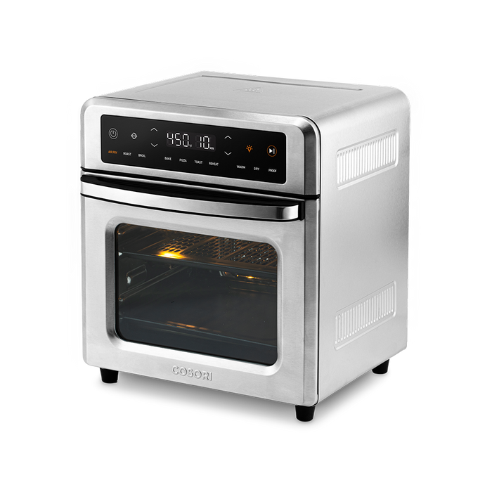 Angled front-left view showcasing the sleek stainless steel exterior design of the Cosori 13-Quart Air Fryer Oven