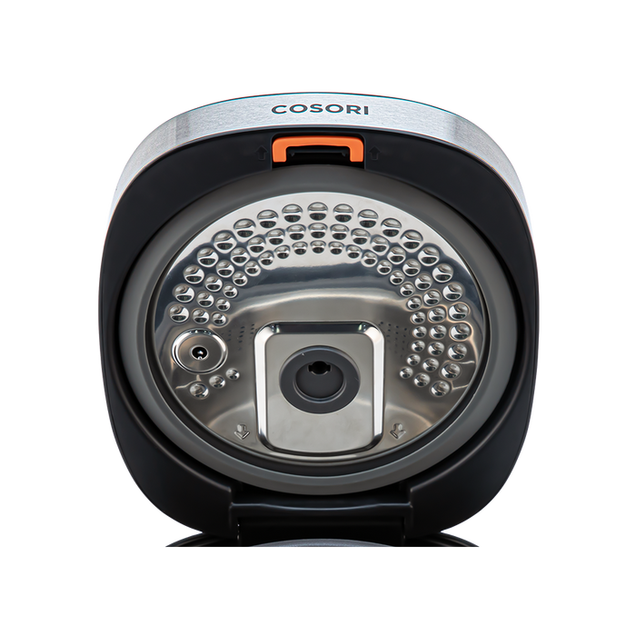 Close-up view of the detachable inner lid inside the Cosori Rice Cooker.