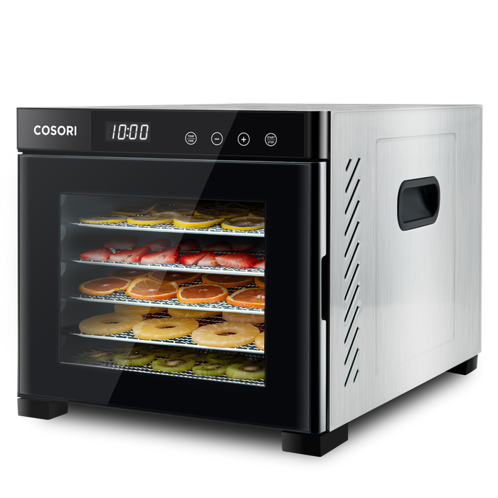 Angled view of COSORI stainless steel food dehydrator with food drying on trays