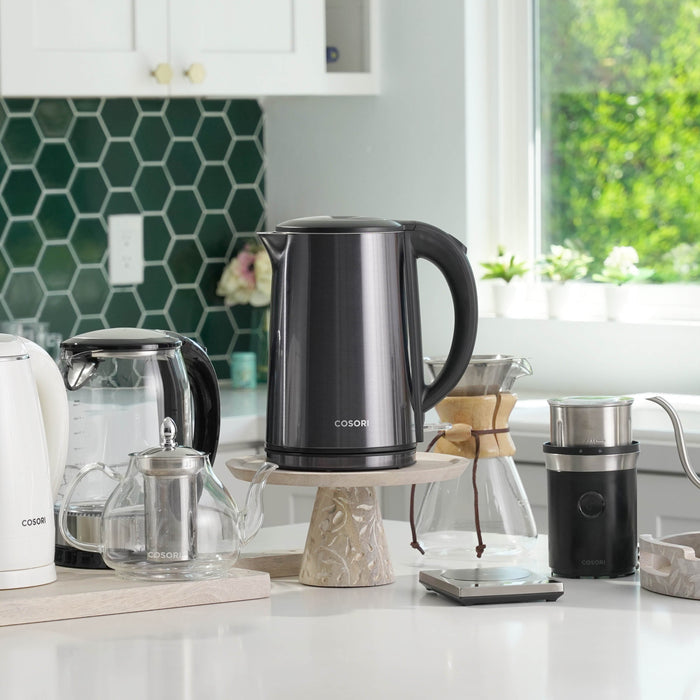 COSORI Double-Wall Stainless Steel Electric Kettle placed on kitchen countertop in home setting