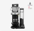 Juni automatic pour-over coffee maker with glass carafe and SCA certification badge