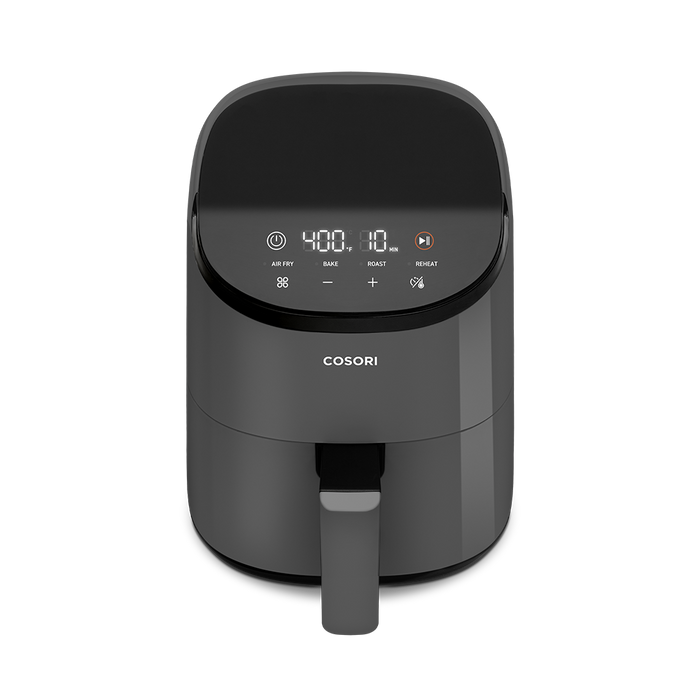 High-angle view of the dark grey Cosori Mini Air Fryer showing its small countertop footprint
