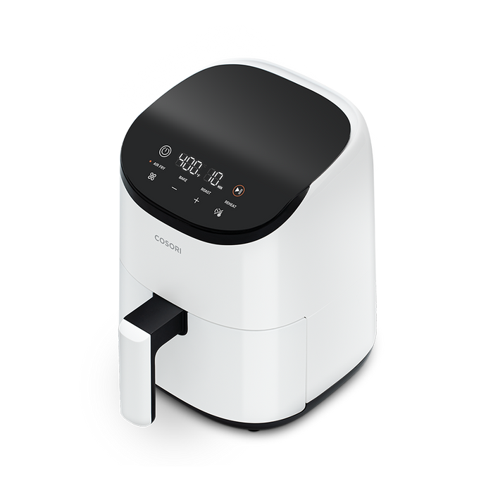 Angled view of the white Cosori Lite 2.1-Quart Mini Air Fryer, ideal for bright kitchen aesthetics.